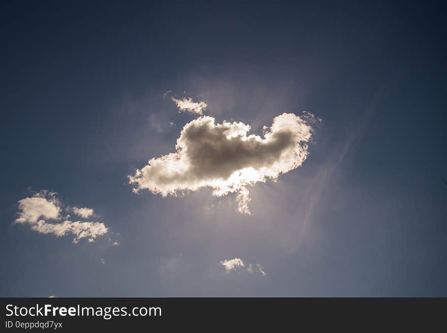 Sun behind a cloud with a silver lining. Sun behind a cloud with a silver lining.