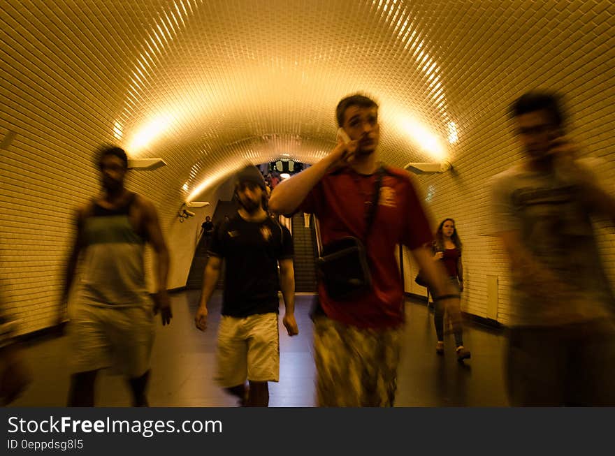 People walking along an underground passage in the subway. People walking along an underground passage in the subway.