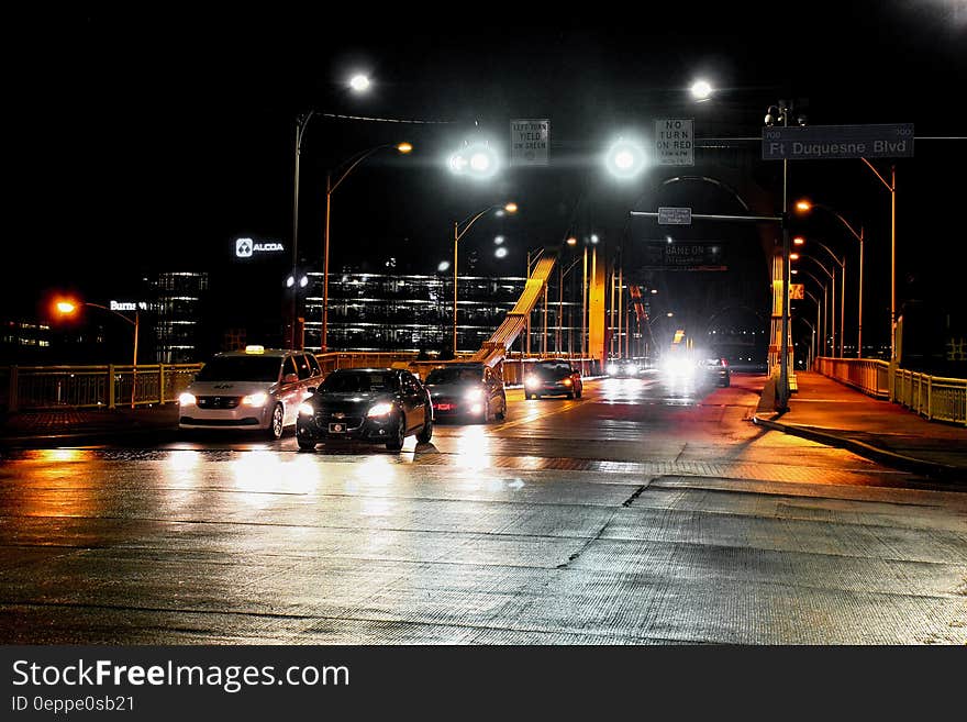 Cars moving along a bridge at night. Cars moving along a bridge at night.