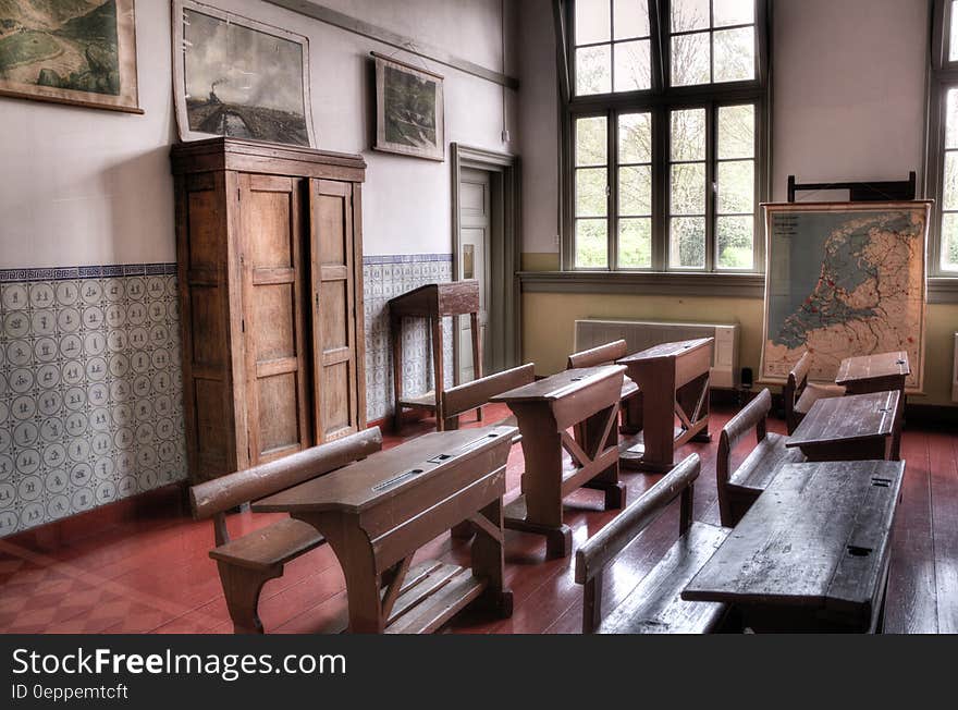 Vintage wooden school desks inside old classroom. Vintage wooden school desks inside old classroom.