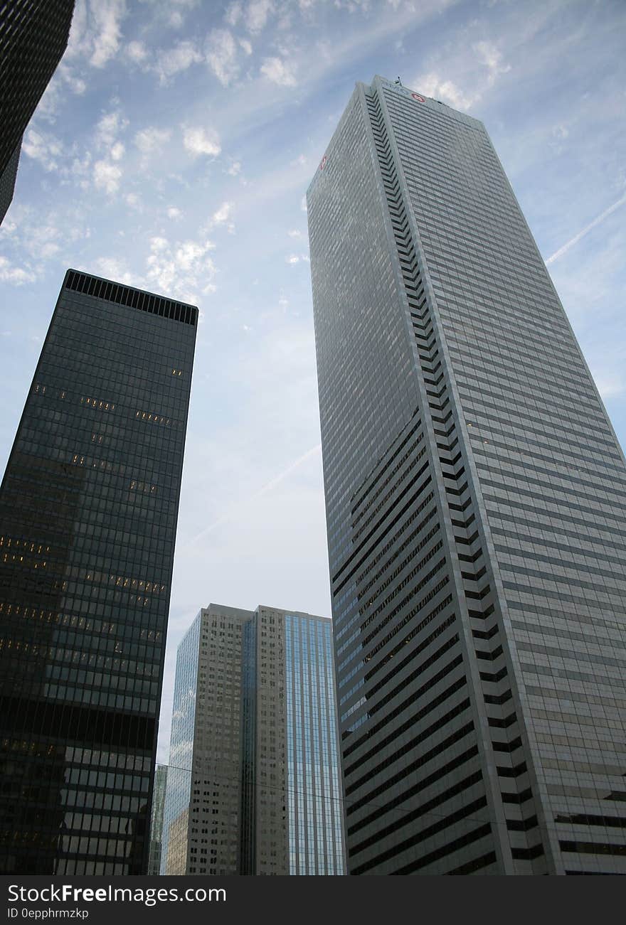 3 Large Building Under White Clouds during Day Time