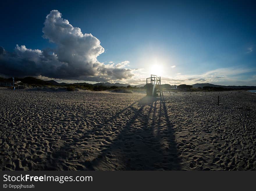 White Beach Sand Under Blue Sky during Daytime