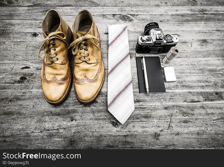 Brown Leather Oxford Wingtip Shoes Beside White and Red Necktie