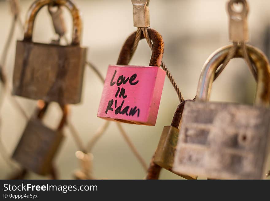 Close up of pink padlock on Rotterdam, Netherlands locks of love fence. Close up of pink padlock on Rotterdam, Netherlands locks of love fence.