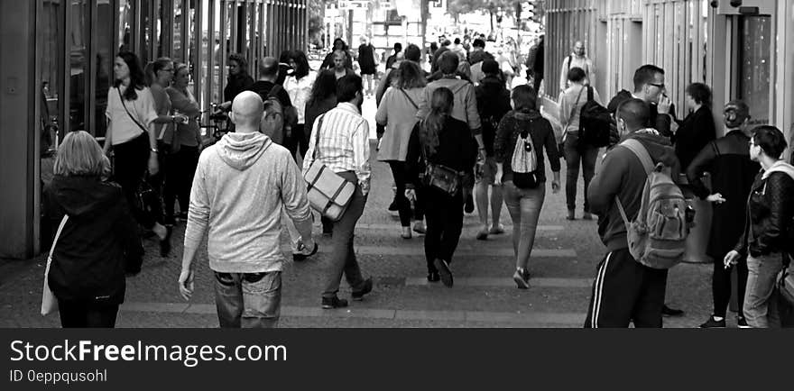 Panorama of pedestrians on city walkway in black and white. Panorama of pedestrians on city walkway in black and white.