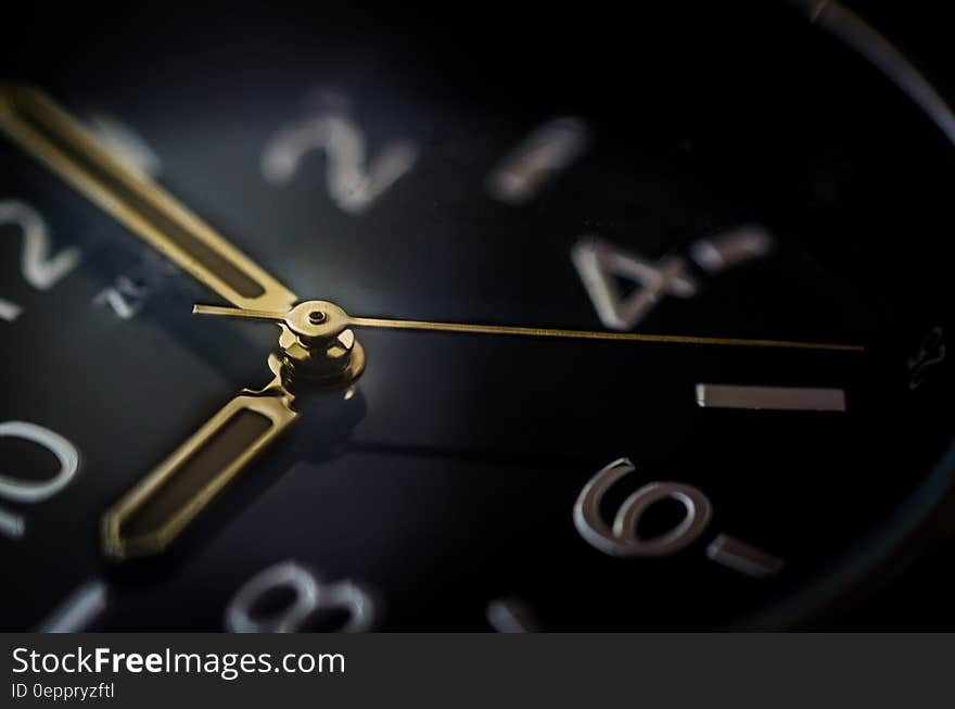 A close up of a wrist watch face.