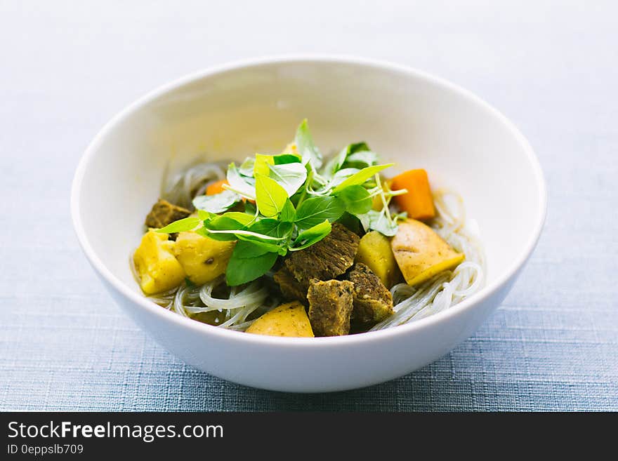 A stir fry with noodles and vegetables.