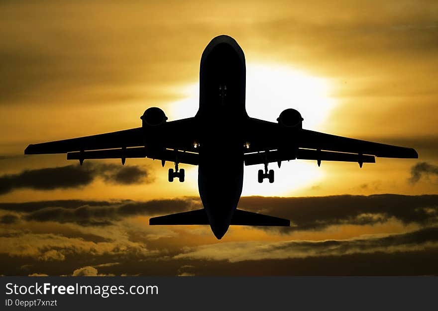 Silhouette of Airplane during Sunset