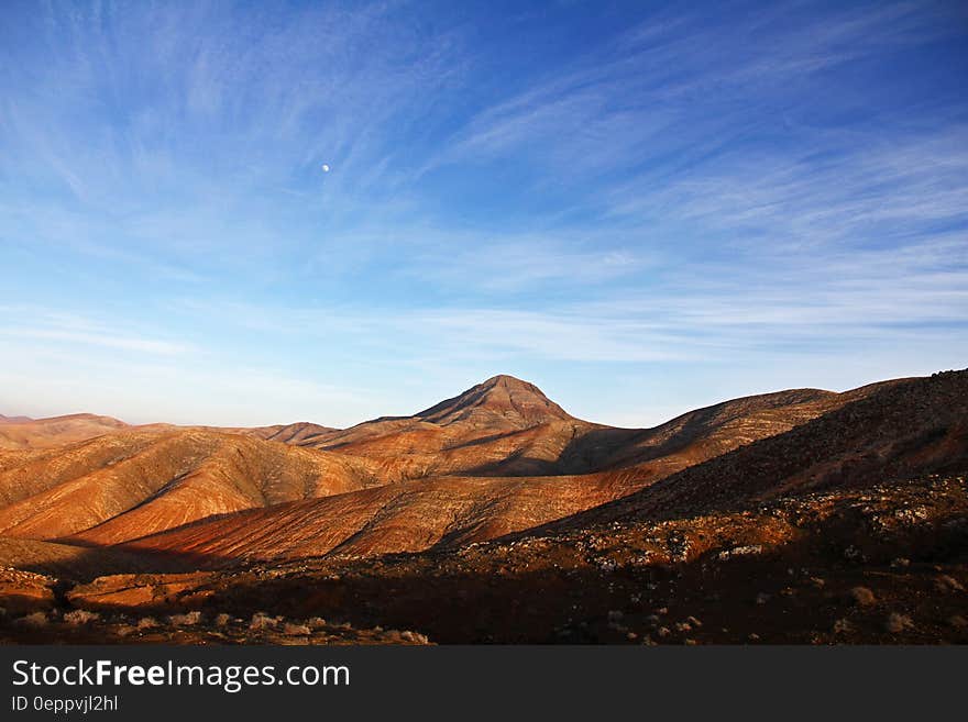 Blue Sky Under Brown Mountain