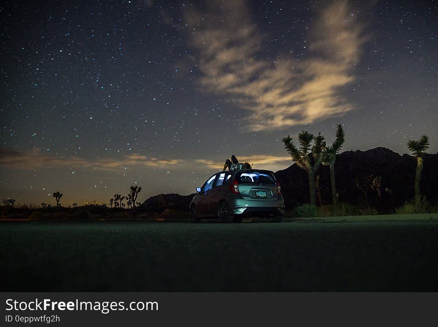 Gray Suv Under Blue Starry Sky during Nighttime