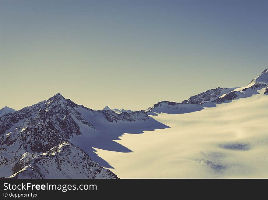 Scenic View of Snow Covered Mountains Against Sky