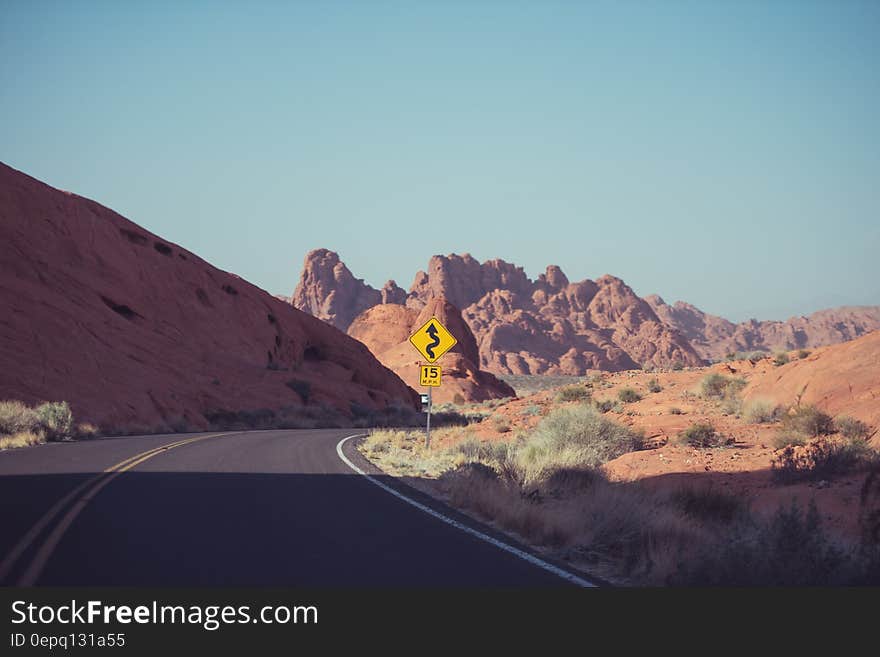 Winding empty country road in Australia desert on sunny day. Winding empty country road in Australia desert on sunny day.