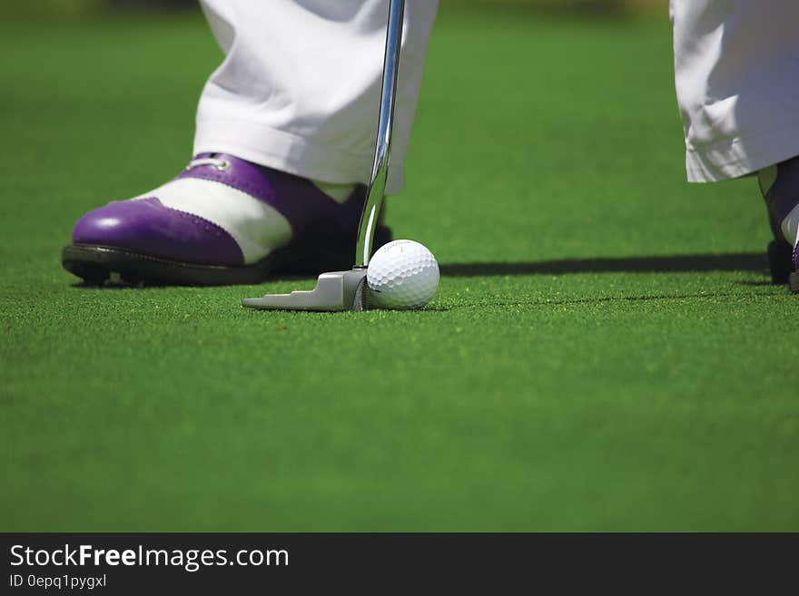 Person in White Pants Playing Golf