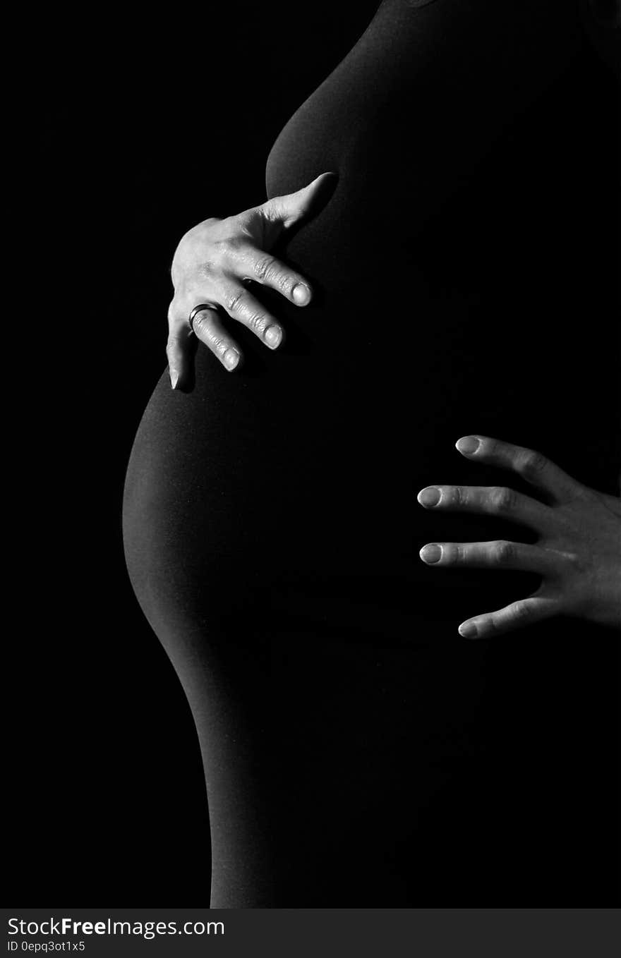 Gray Scale Photo of a Pregnant Woman