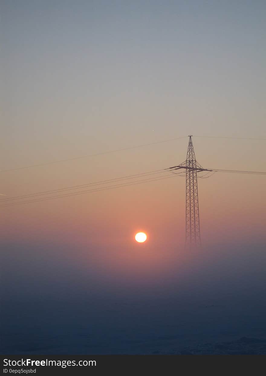 Electricity pylon is misty landscape at sunrise. Electricity pylon is misty landscape at sunrise.