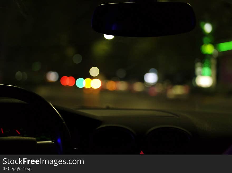 Bokeh of city lights through car window at night. Bokeh of city lights through car window at night.