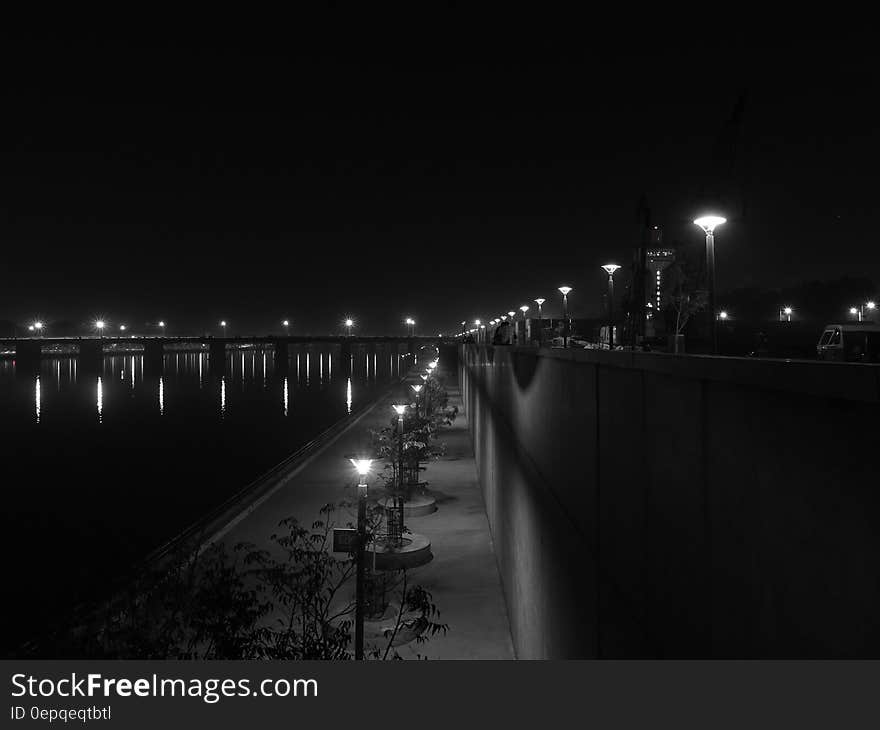 Lights Turned on during Nighttime in Grayscale Photography