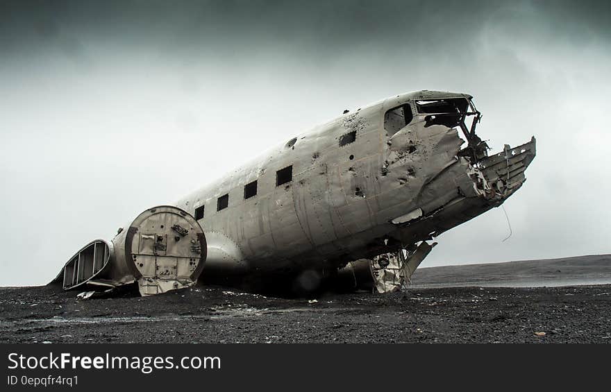 Wrecked airplane in field in black and white. Wrecked airplane in field in black and white.