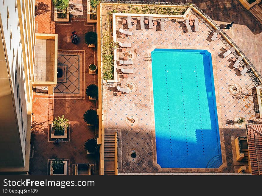 Rectangular Pool Near High Rise Building during Daytime