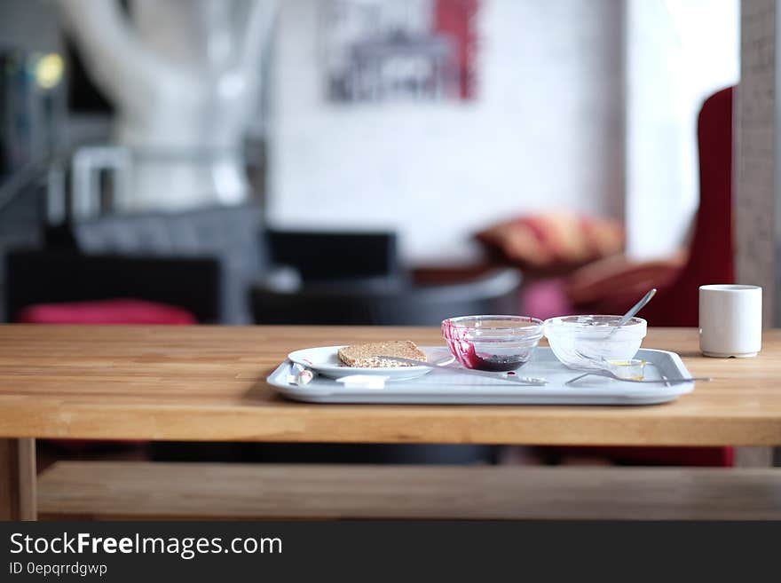 Stainless Steel Tray on Brown Wooden Table