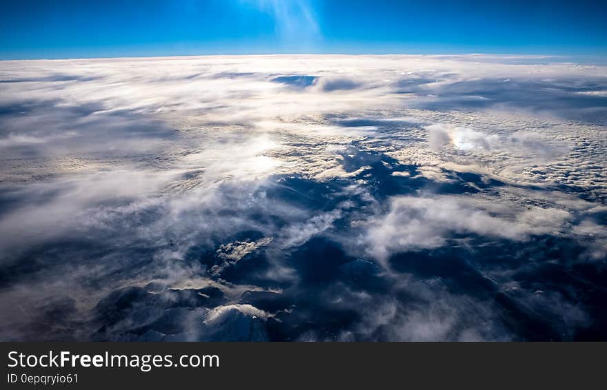 Aerial view of cloudscape over blue sea. Aerial view of cloudscape over blue sea.