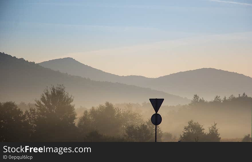 Fog over mountain valley at sunset. Fog over mountain valley at sunset.