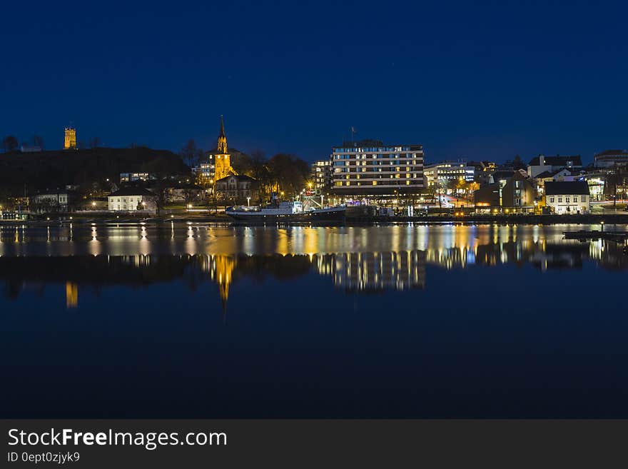 City Skyline and River at Night