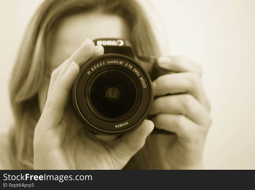 Woman Taking a Picture Using Canon Dslr