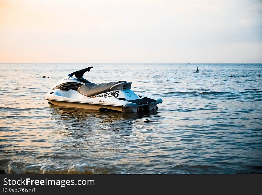 A jet ski resting on the sea. A jet ski resting on the sea.