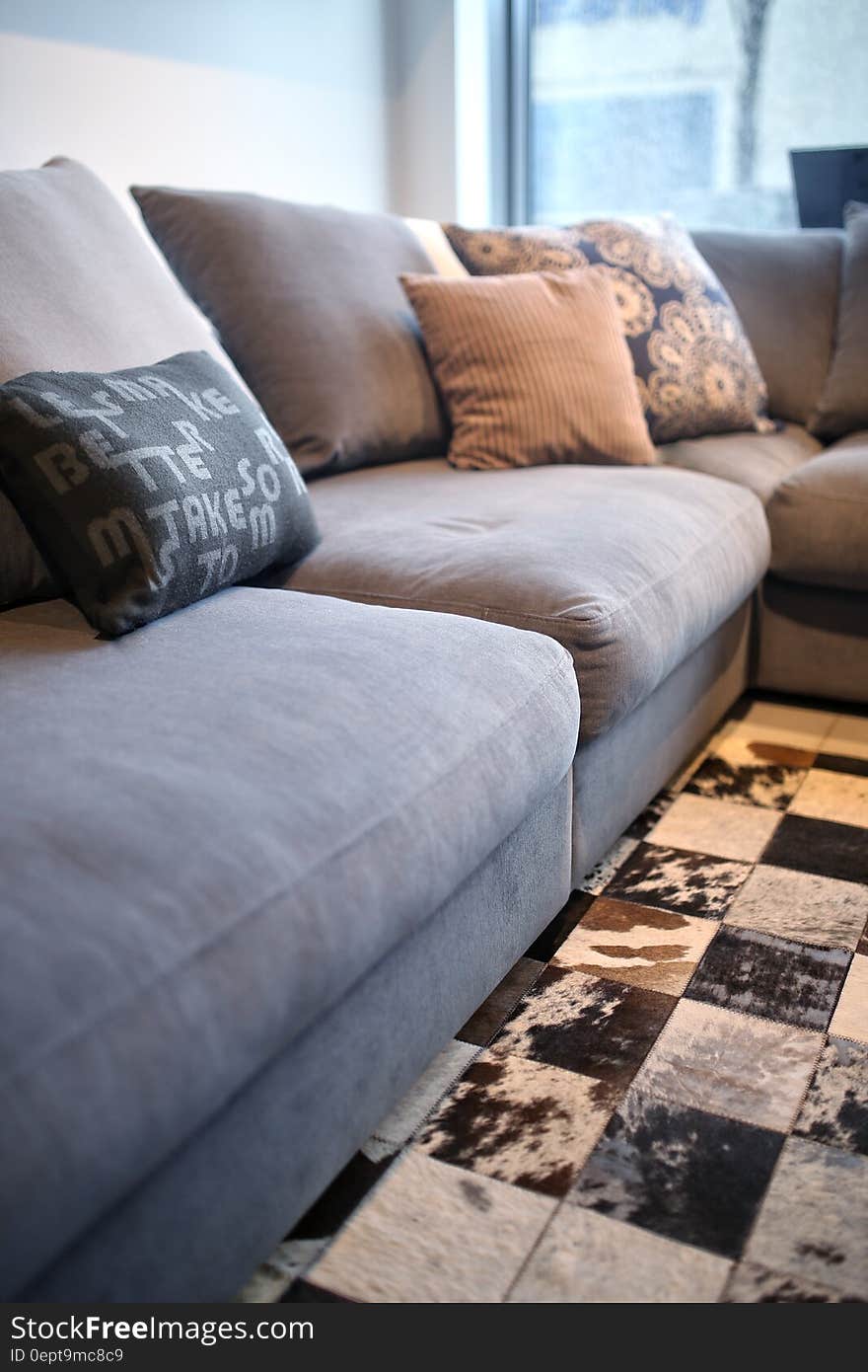 Comfortable grey couch with pillows