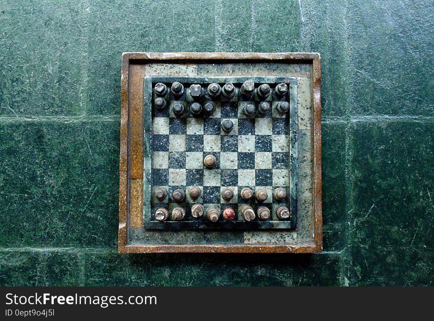 A vintage chessboard on stone.