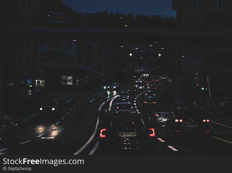 Headlights and taillights of cars on city roadway at night. Headlights and taillights of cars on city roadway at night.