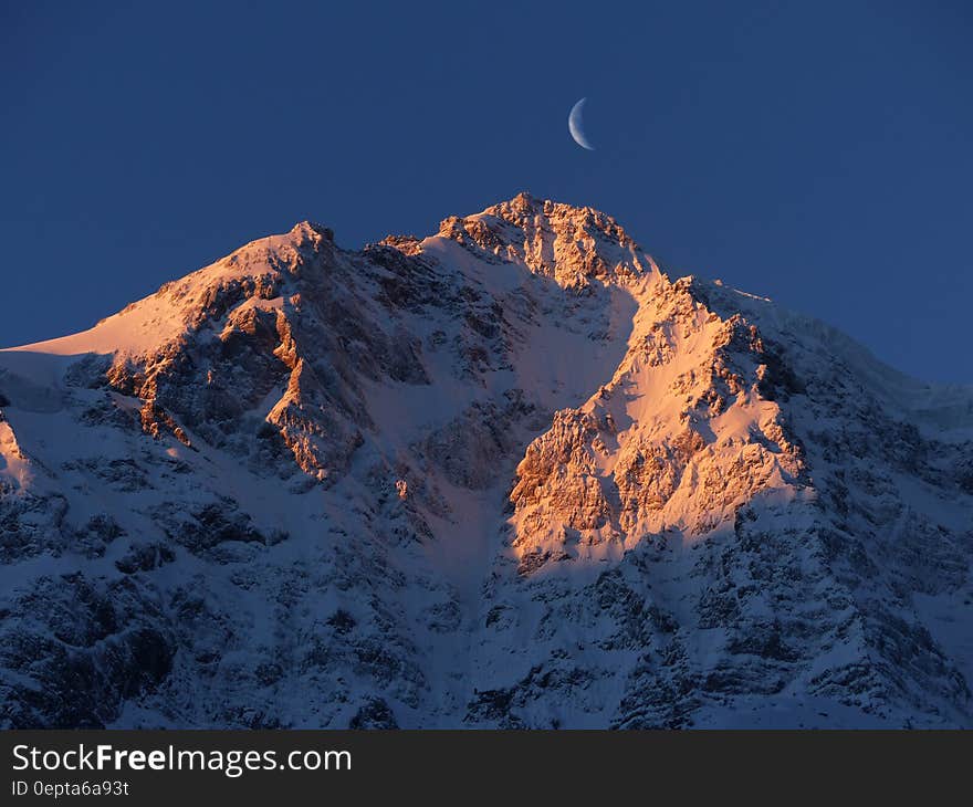 Crescent Moon over Snow Mountain