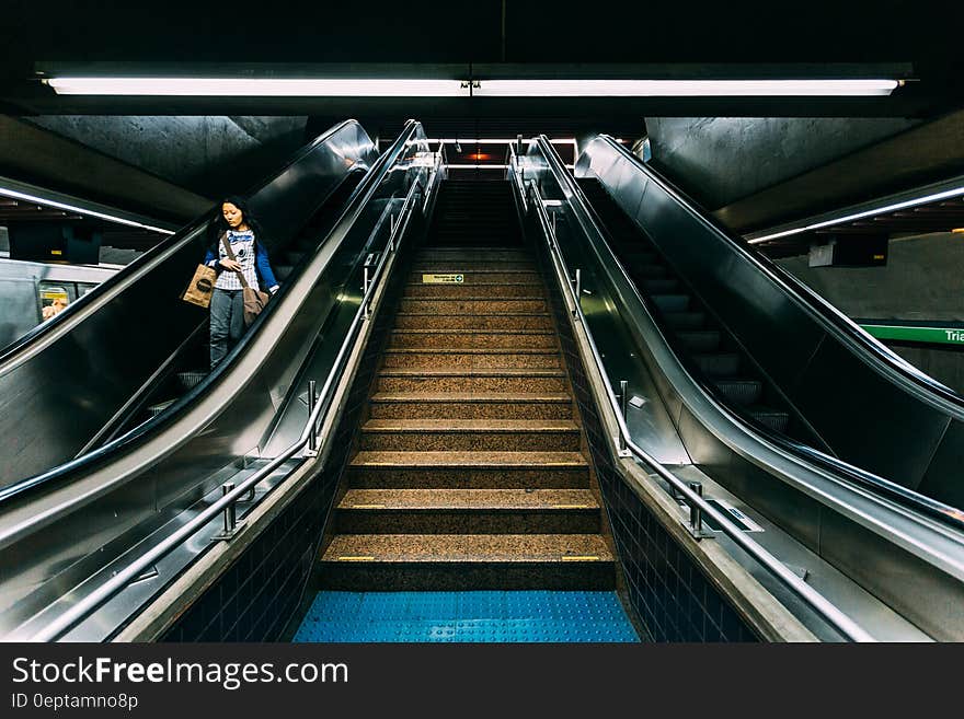 Woman on Escalator in Subway