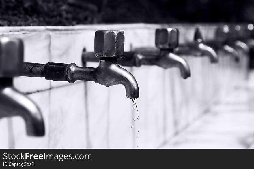 Water Drops from Stainless Steel Faucet