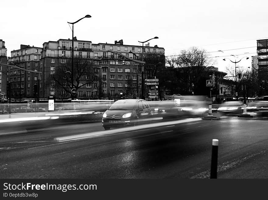 Vehicles on Road in Grayscale Photography