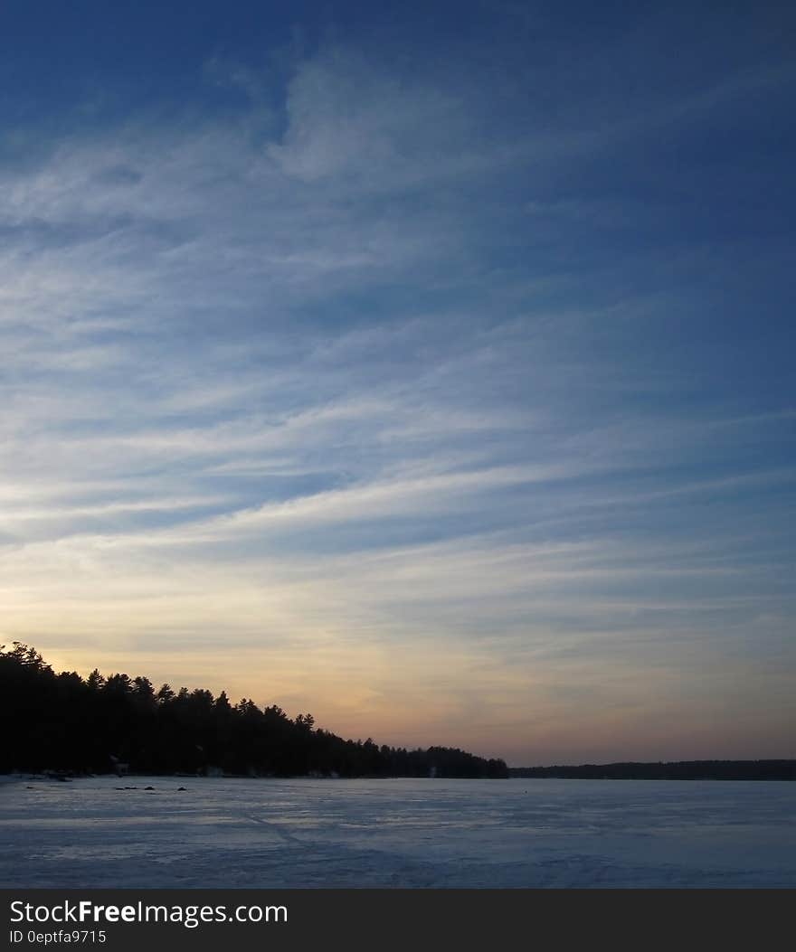 A blue sky over a frozen lake. A blue sky over a frozen lake.