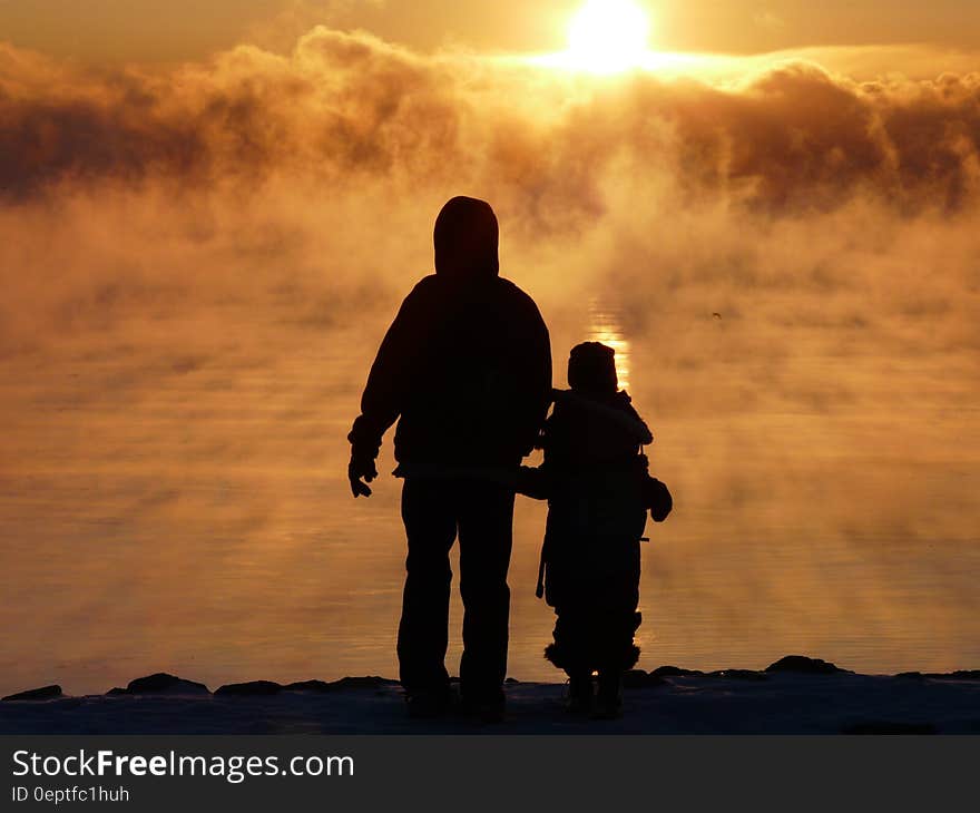 Silhouette Photography of Two Person during Sunset