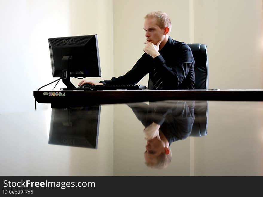 Man Sitting Facing Pc Inside Room