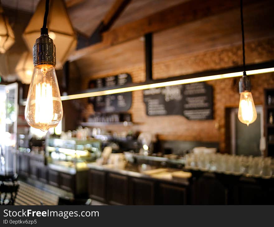 Close up of electric light bulb inside cafe. Close up of electric light bulb inside cafe.