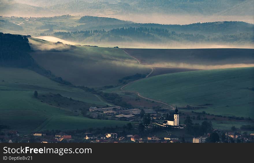 Village in hillside valley at sunset. Village in hillside valley at sunset.