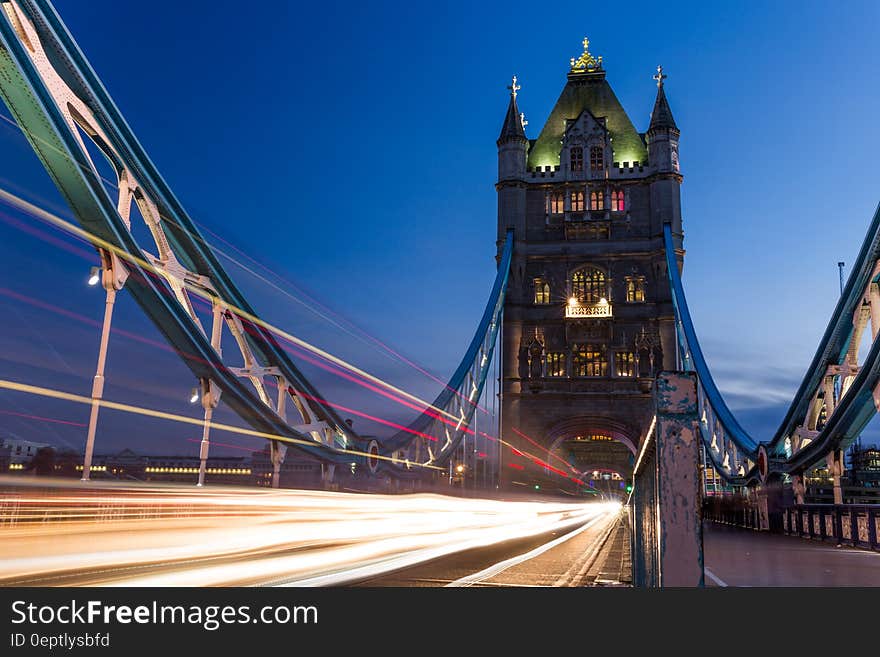 Blur of traffic lights over Tower of London Bridge, England at night. Blur of traffic lights over Tower of London Bridge, England at night.