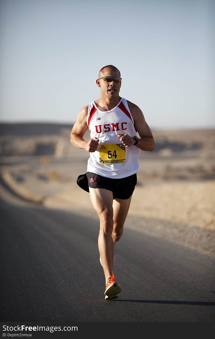 Man in White Jersey While Running