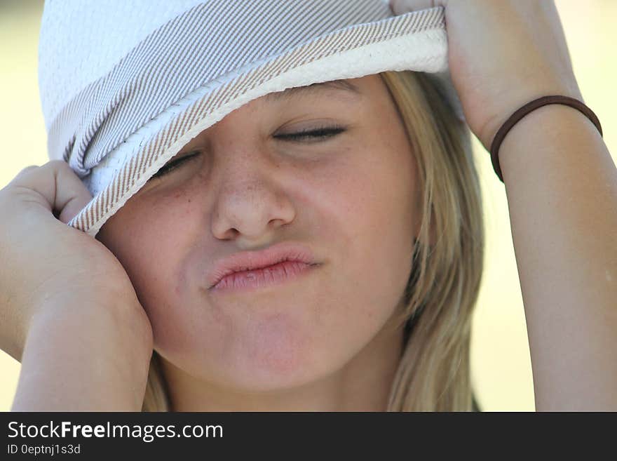 Woman in White and Grey Fedora Hat