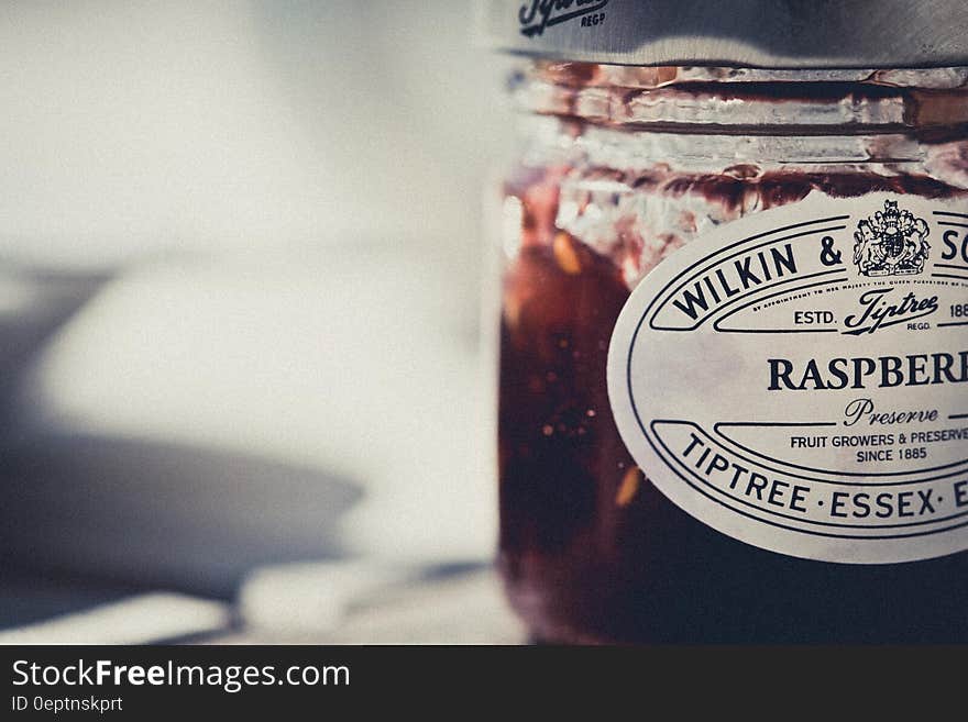 Close up of jar of English raspberry preserves.