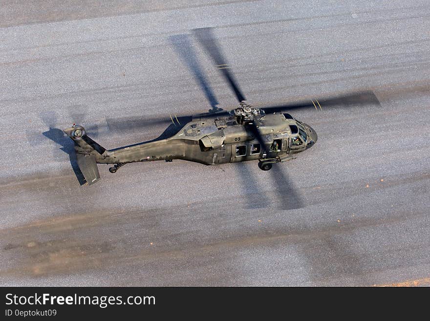 Gray Helicopter on Gray Road