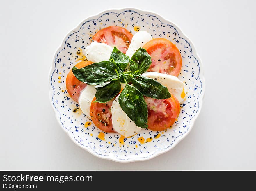 Vegetable Salad on White and Blue Round Floral Plate