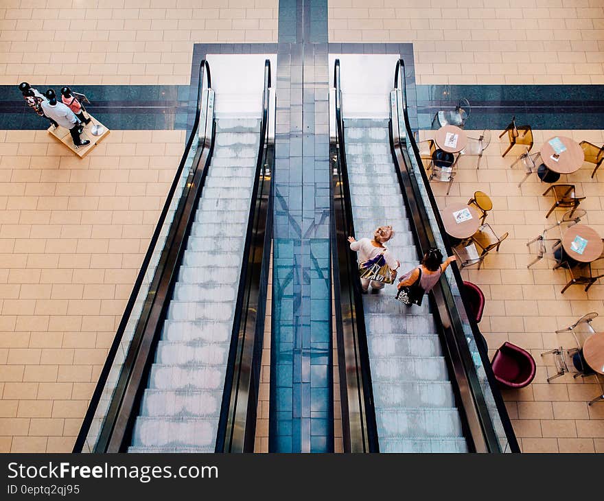 A pair of escalators in a shopping mall. A pair of escalators in a shopping mall.