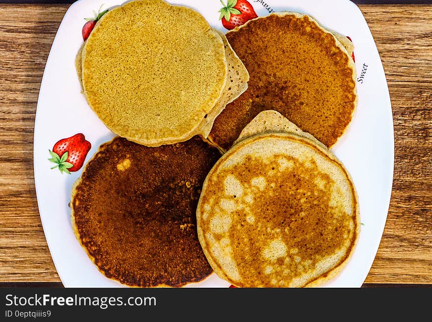 A plate of fried pancakes. A plate of fried pancakes.