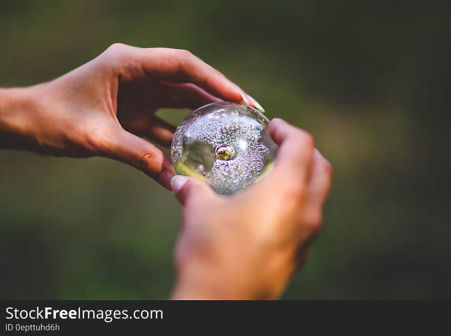 Crystal ball in hands